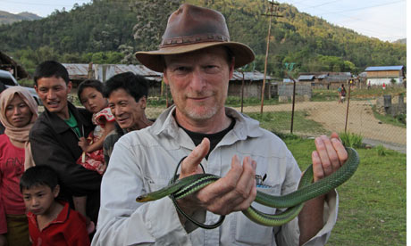 Kevin Rushby holds a (non-venomous) rat snake