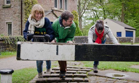 Nell Card, left, with two of her friends tackle a lock on the Peak District canal