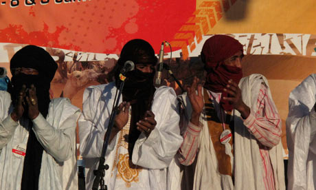 Tuareg performers on stage at the Festival au Désert