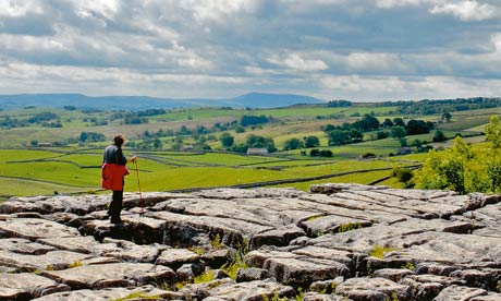 Walker on top of Malham Cove Yorkshire