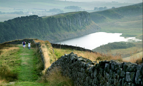 Walkers by Crag Lough, near Housesteads Fort