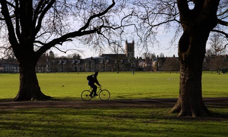 A cyclist on Jesus Green in Cambridge