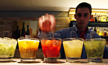 A barman prepares caipirinhas, a cocktail made with cachaça, in a restaurant in São Paulo