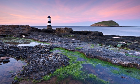 Penmon Point lighthouse and Puffin Island, Anglesey, Wales, UK. Spring (April) 2011.