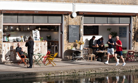 Hackney, Regent's Canal, joggers in front of Towpath cafe open in 2010 by the canal