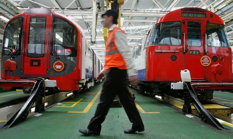 New Victoria line tube trains unveiled A worker walks between an old 