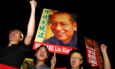 Pro-democracy protesters raise pictures of Chinese dissident Liu  Xiaobo