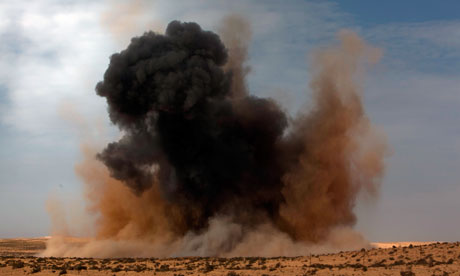 A bomb is dropped by the Libyan airforce on the outskirts of Brega