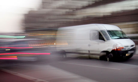 A white van drives through London traffic