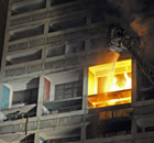 Firefighters attend a blaze at Le Corbusier's Cite Radieuse in Marseille 