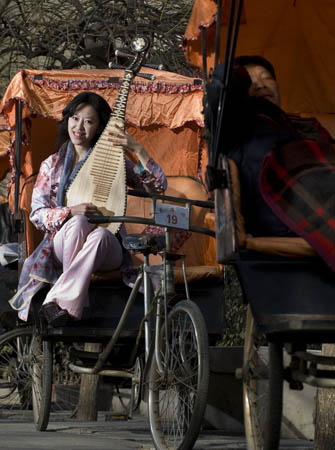 Pipa player Zhao Cong pictured near Beijing's Drum Tower