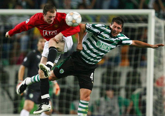 Wayne Rooney heads the ball
