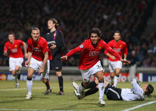 Carlos Tevez wheels away in delight