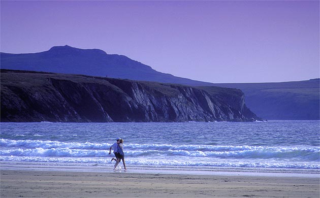 People on the beach at White Sands Bay, St David's, Pembrokeshire