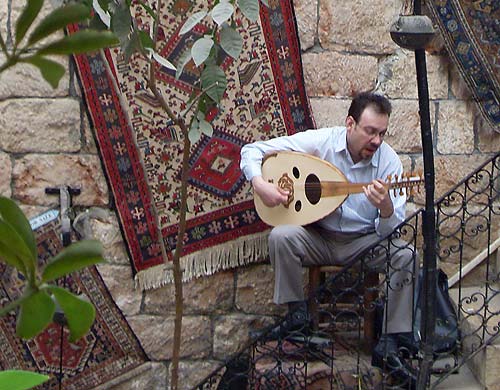 A Syrian man plays the oud