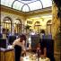A waiter serves guests in the Plaza Hotel