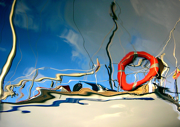 Reflection of a boat in the water in Puerto de Mogan, Gran Canaria