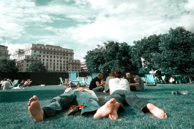 Sunbathers in Green Park, London