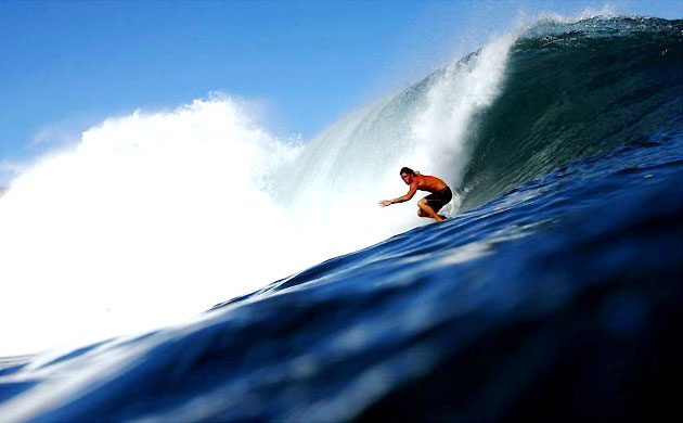 A surfer at Kapalua, Maui, Hawaii