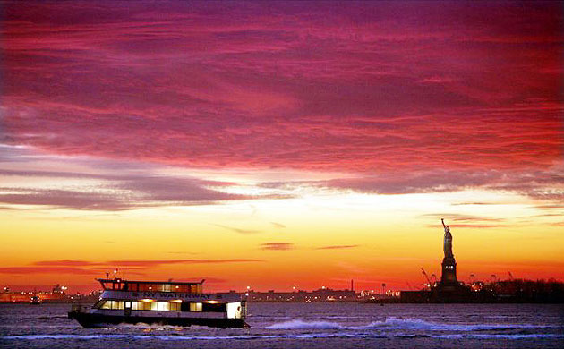 A ferry in front of the Statue of Liberty, New York 