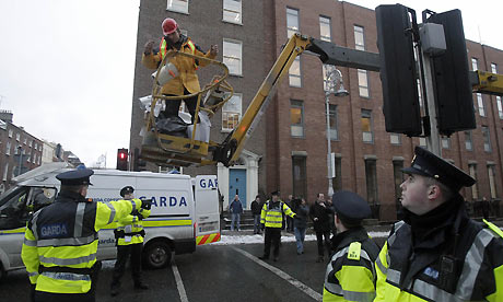 Protestor on a crane near the Irish Dail, 7 December 2010
