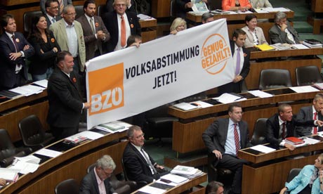 Buendnis Zukunft Oesterreich party (BZOe) hold up a banner reading 'referendum now'
