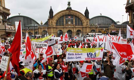 Members of union Verdi attend a demonstration during a warning strike in Frankfurt