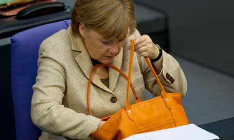 German Chancellor Merkel attends a debate after delivering statement on her government policies.