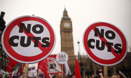 A march in protest at government cuts passes parliament in London on its way to Hyde Park