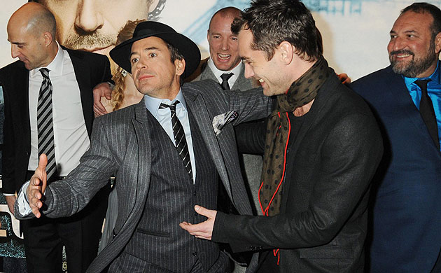 Sherlock Holmes: Robert Downey Jr and Jude Law with cast and crew of Sherlock Holmes