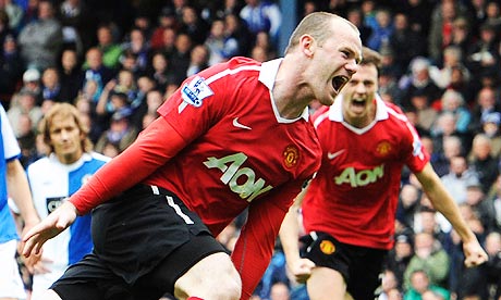 Manchester United's Wayne Rooney celebrates his penalty against Blackburn Rovers