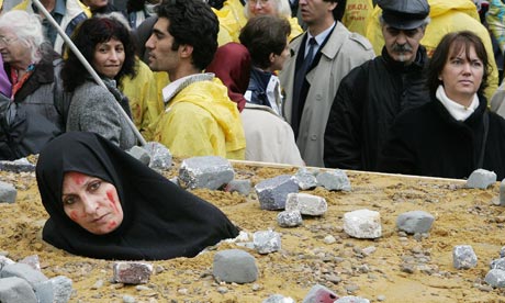 An Iranian woman at a protest in Brussels highlights the barbarity of death by stoning