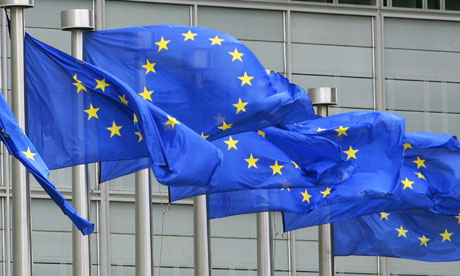 EU flags are seen outside the European Commission headquarters in Brussels