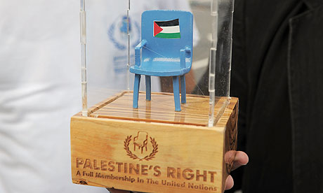 A member of the Palestinian delgation holds a symbolic seat outside the United Nations in New York.