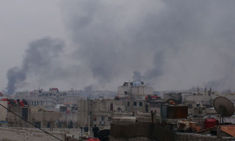Smoke rises from the suburb of Erbeen in Damascus