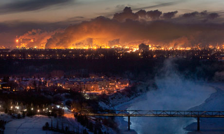 Steam rises from oil refineries over Edmonton in Alberta