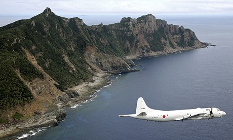 A Japanese surveillance plane flies over the disputed islands in the East China sea