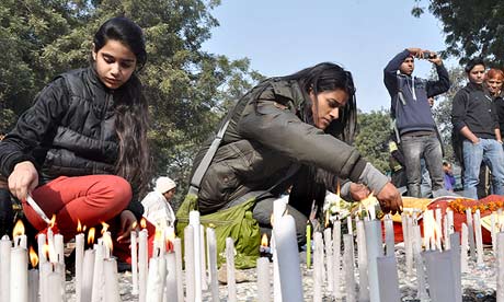Indian people light candles in memory of a gang-rape victim in New Delhi