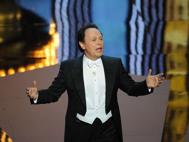 Oscars 2012 host Billy Crystal sings at the start of the 84th Academy Awards