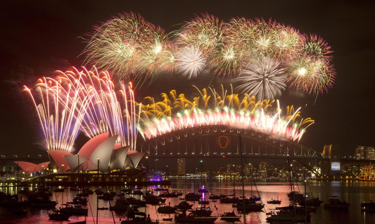 Sydney fireworks beamed to a billion people as Australians gather