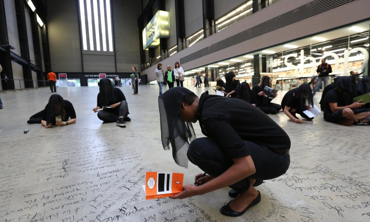 Tate Modern's Turbine Hall daubed with graffiti by protesters against BP sponsorship – video