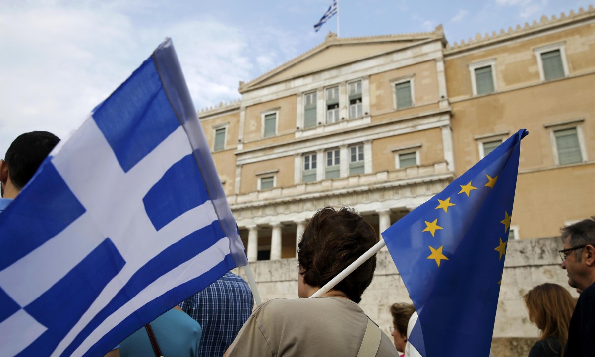 Greece will be in default tomorrow, says Eurogroup president – video