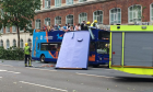 Roof ripped off bus packed with tourists in London - video