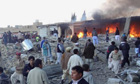 Pakistan market bomb kills scores