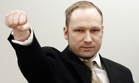 Anders Behring Breivik makes a far-right salute as he enters the Oslo district courtroom