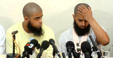 Abul Koyair and Mohammed Abdulkayar at a press conference after their release 