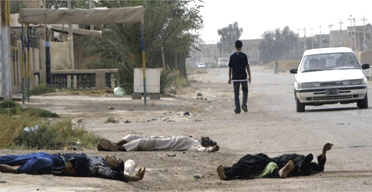 Corpses of Shia family members strewn across a road after they were killed by suspected insurgents near Baquba, Iraq