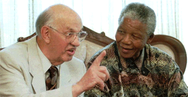 Former apartheid-era president PW Botha at a press conference with Nelson Mandela in 1995