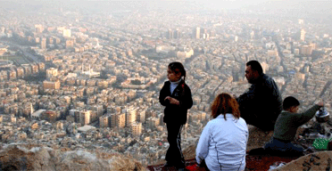 A Syrian family enjoys the view over Damascus 