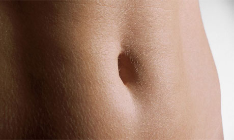 Woman's stomach, skin, belly button